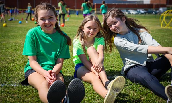 Three girls smile